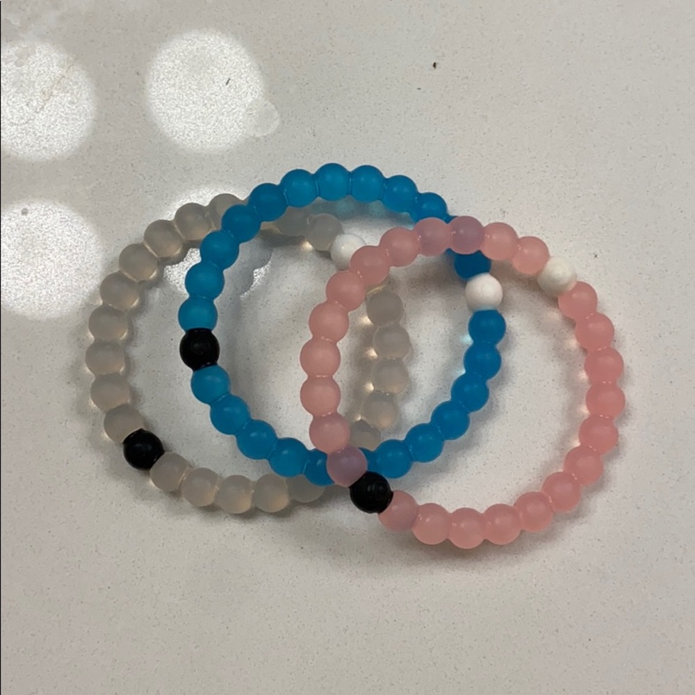 3 different color lokai bracelets